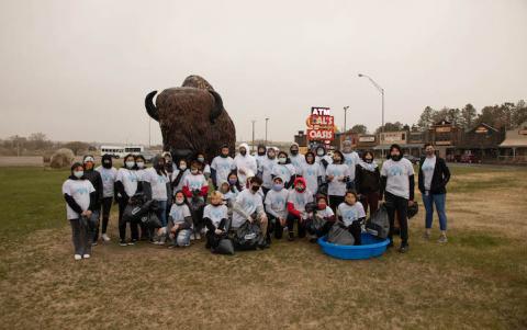 Students posing with buffalo