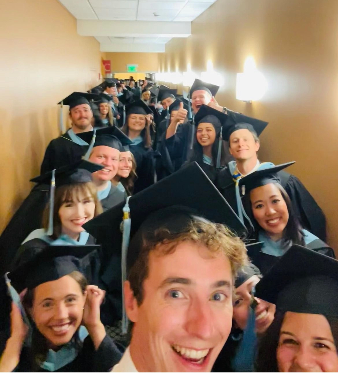 ACE 29s taking a selfie right before Graduation in their regalia