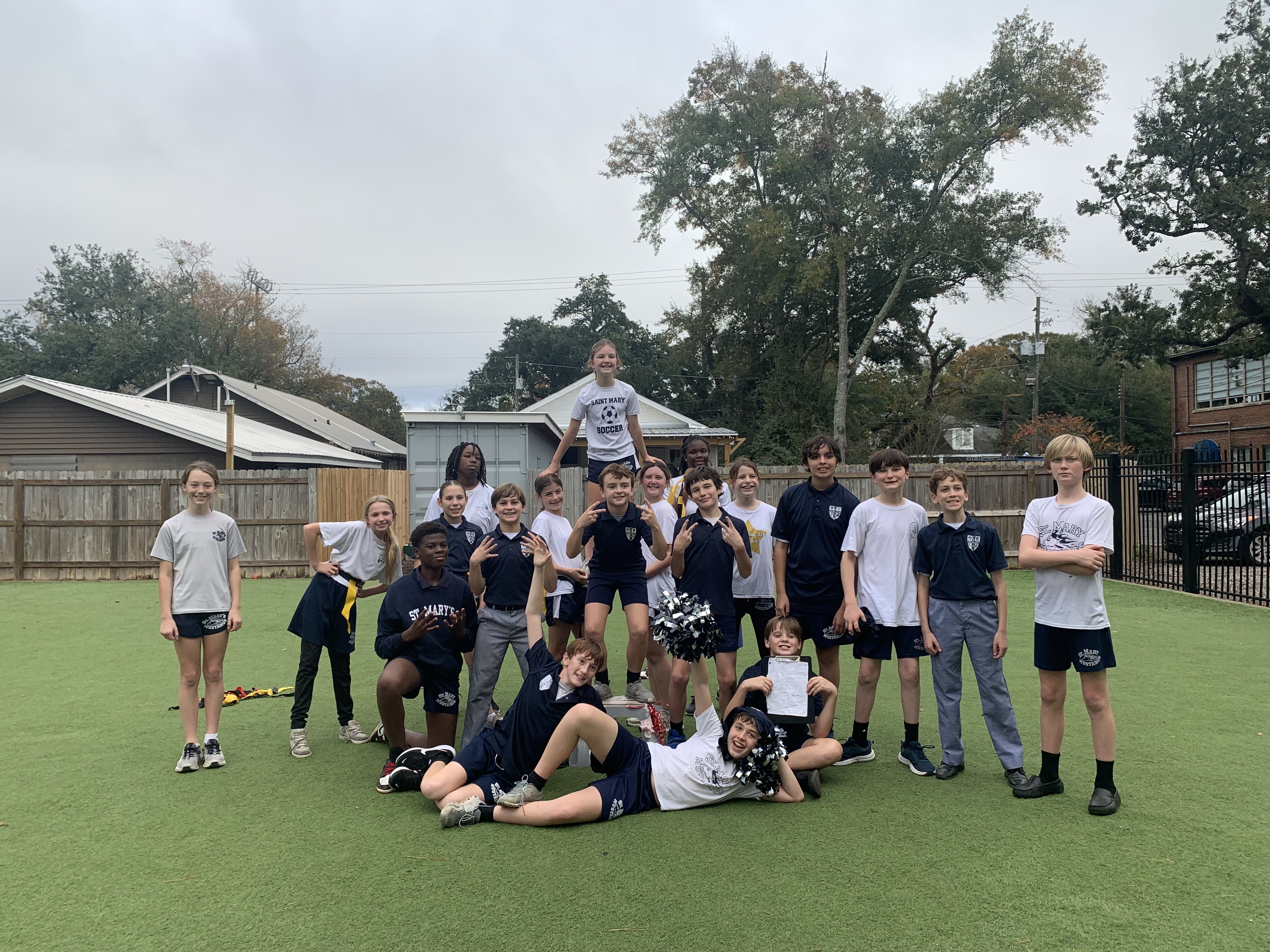 Ms. Hall's students posing for a photo after their flag football tournament