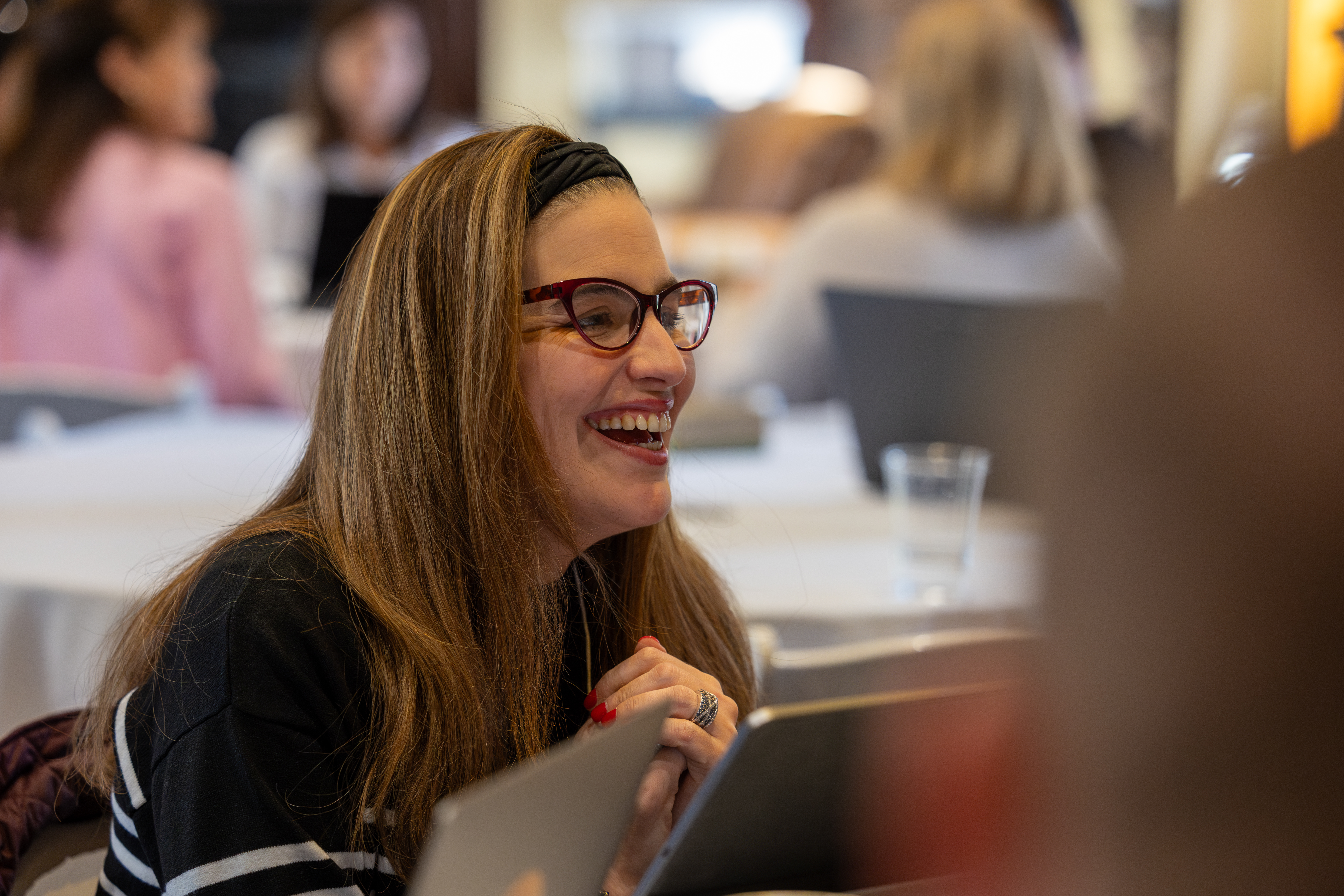 Lewis Poche discussing at table