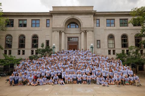The ACE community gathers on the steps of Bond Hall to show off the new gray t-shirt.
