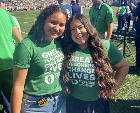 ACE Interns Maria Vaquero (Left) and Jackie Perez (Right) on the ND Football field in recognition for Extra Yard for Teachers