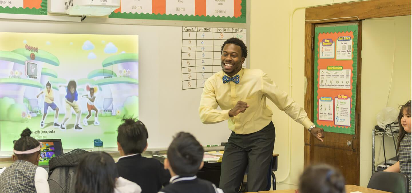 Teacher dancing in front of students