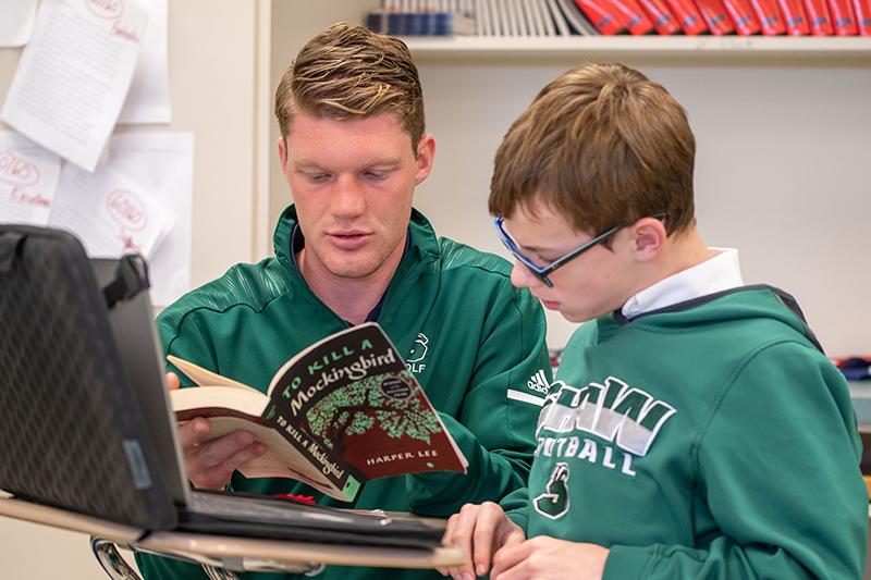 Teacher reading with student