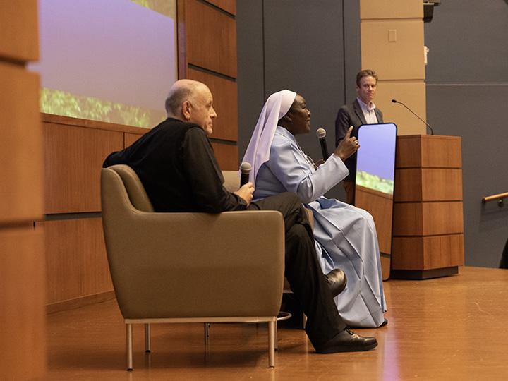 Sr. Draru speaks to class while Fr. Bechina listens