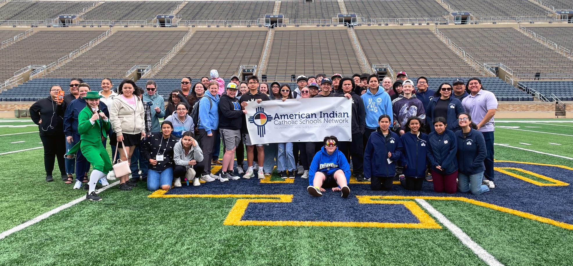 Students on field at Notre Dame stadium